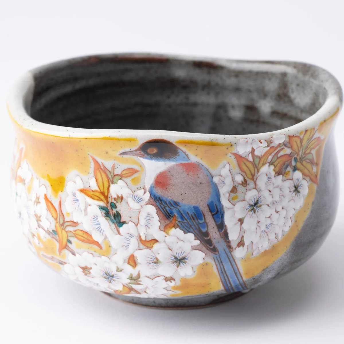 https://www.eyesandhour.com/wp-content/uploads/2023/11/bizan-kiln-yoshidaya-sakura-and-bird-kutani-matcha-bowl-chawan-musubi-kiln-handmade-japanese-tableware-and-japanese-dinnerware-109843_1200x.webp